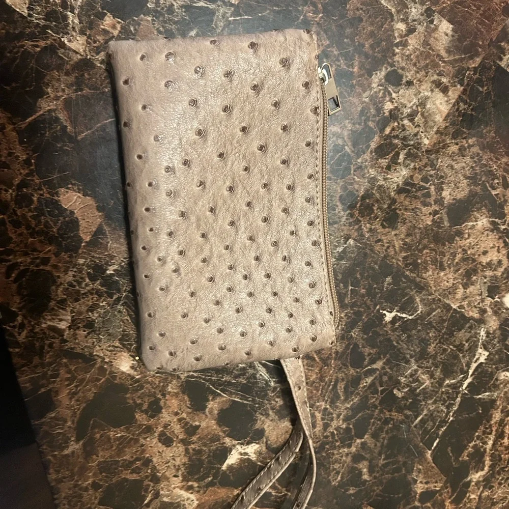 Beige Ostrich textured wristlet with polka dot lining